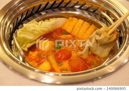 Chinese Hot Pot with Spicy Broth and Fresh Ingredients 140066905