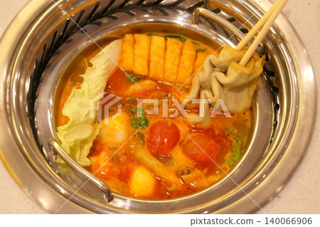 Chinese Hot Pot with Spicy Broth and Fresh Ingredients Chinese Hot Pot with Spicy Broth and Fresh Ingredients 140066906