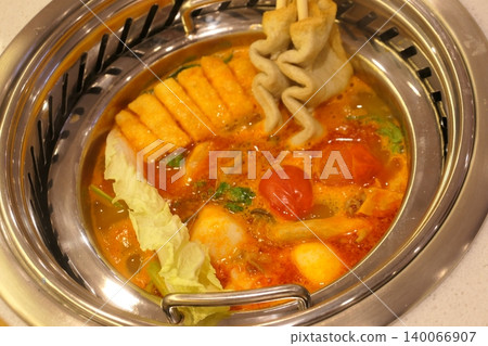 Chinese Hot Pot with Spicy Broth and Fresh Ingredients Chinese Hot Pot with Spicy Broth and Fresh Ingredients 140066907