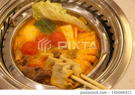 Chinese Hot Pot with Spicy Broth and Fresh Ingredients Chinese Hot Pot with Spicy Broth and Fresh Ingredients 140066921