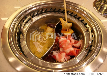 Chinese Hot Pot with Spicy Broth and Fresh Ingredients Chinese Hot Pot with Spicy Broth and Fresh Ingredients 140066928