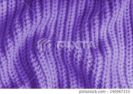 Crumpled purple knitted fabric texture with folds, wrinkles and soft waves, wool background Crumpled purple knitted fabric texture with folds, wrinkles and soft waves, wool background 140067153