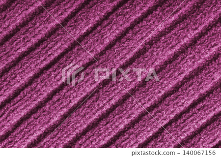 Pink colored knitted fabric, knitwear texture with diagonal soft ribbed pattern background Pink colored knitted fabric, knitwear texture with diagonal soft ribbed pattern background 140067156