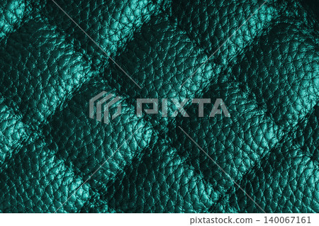 Macro of turquoise quilted leather texture background with stitched pattern and shining metal effect Macro of turquoise quilted leather texture background with stitched pattern and shining metal effect 140067161
