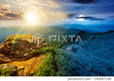 day meet night. mountainous countryside scenery. epic sky above the distant valley at twilight. sun and moon over green meadows and rocks on the hill. wonderful nature scenery of carpathian mountains 140067196