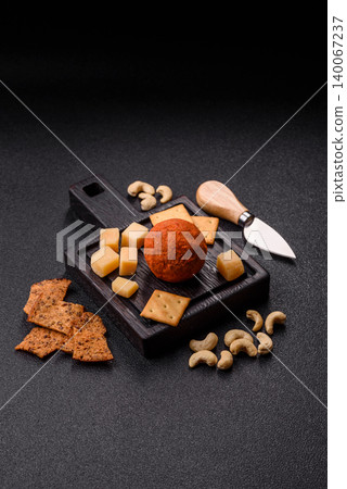 Aged Belper Knolle cheese with jam, crackers, and nuts. Belper Knolle cheese Aged Belper Knolle cheese with jam, crackers, and nuts. Belper Knolle cheese 140067237