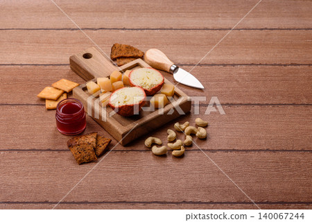 Aged Belper Knolle cheese with jam, crackers, and nuts. Belper Knolle cheese 140067244