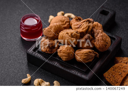 Dried whole fig as an ingredient for sweet desserts. Dried figs as a food Dried whole fig as an ingredient for sweet desserts. Dried figs as a food 140067249