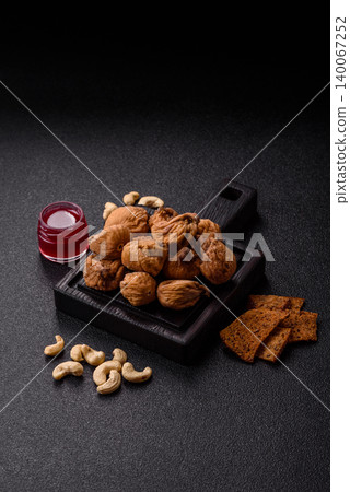 Dried whole fig as an ingredient for sweet desserts. Dried figs as a food Dried whole fig as an ingredient for sweet desserts. Dried figs as a food 140067252