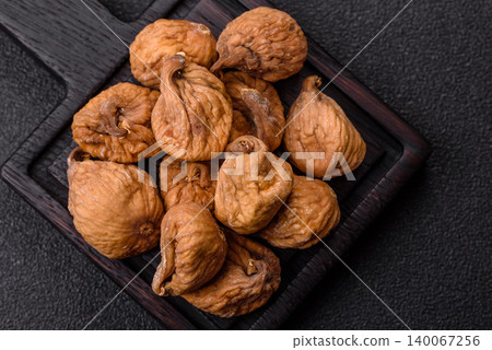 Dried whole fig as an ingredient for sweet desserts. Dried figs as a food Dried whole fig as an ingredient for sweet desserts. Dried figs as a food 140067256