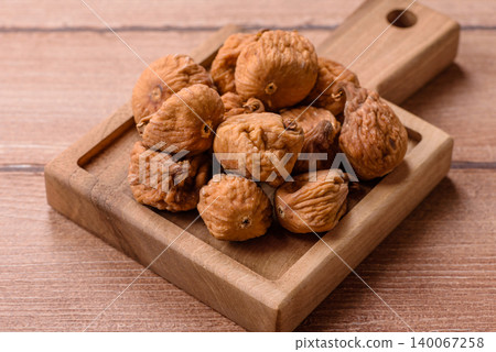 Dried whole fig as an ingredient for sweet desserts. Dried figs as a food Dried whole fig as an ingredient for sweet desserts. Dried figs as a food 140067258