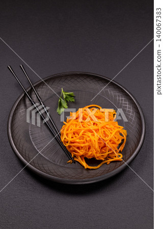 Korean carrot salad morkovcha with chopsticks Korean carrot salad morkovcha with chopsticks 140067383