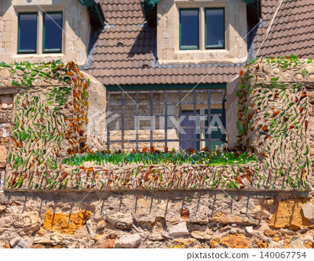 Stone wall with embedded glass fragments for security in Cascais Portugal Stone wall with embedded glass fragments for security in Cascais Portugal 140067754