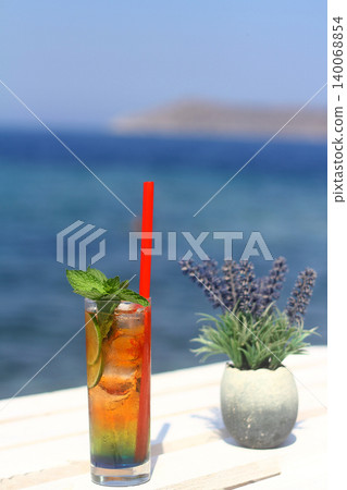 Summer cocktail on the background of the sea. Summer vacation, relaxation, summer party. Summer cocktail on the background of the sea. Summer vacation, relaxation, summer party. 140068854