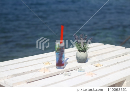 Summer cocktail on the background of the  sea. Summer vacation, relaxation, summer party. 140068861