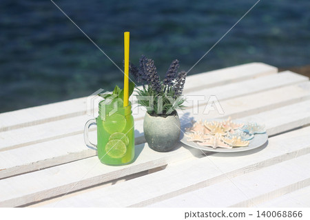 Summer cocktail on the background of the  sea. Summer vacation, relaxation, summer party. 140068866