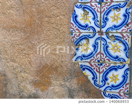 Aged Portuguese azulejos tiles on rustic clay wall Aged Portuguese azulejos tiles on rustic clay wall 140068933