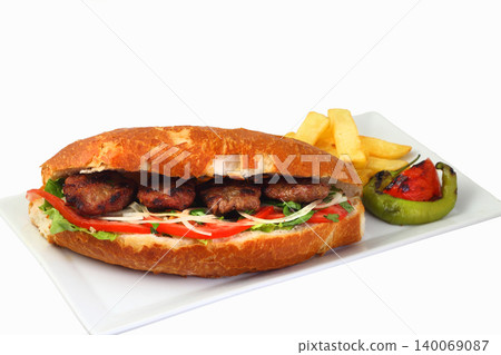 Delicious Turkish Kofte Sandwich (meatballs) isolated white background Delicious Turkish Kofte Sandwich (meatballs) isolated white background 140069087