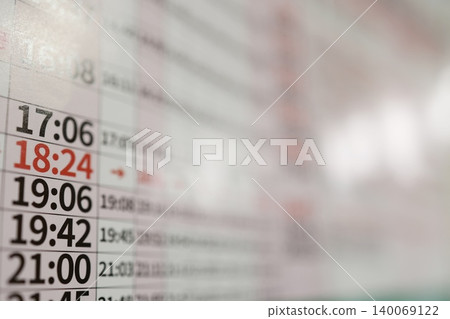 Train timetable. Close-up. Red time display. Copy space available. Train timetable. Close-up. Red time display. Copy space available. 140069122