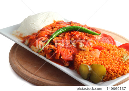 Turkish cuisine. Doner kebab meat with pommes frites potatoes and salad on plate isolated on white background 140069187