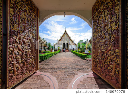 Thai style buddhis temple in cloudy bright blue sky Thai style buddhis temple in cloudy bright blue sky 140070076