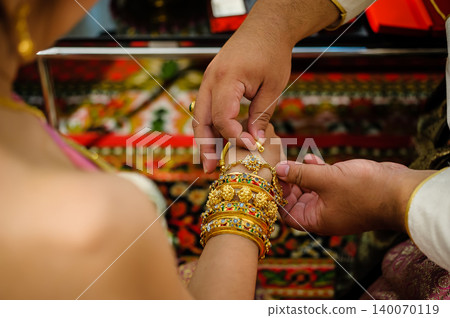 wedding rings together in hands wedding rings together in hands 140070119