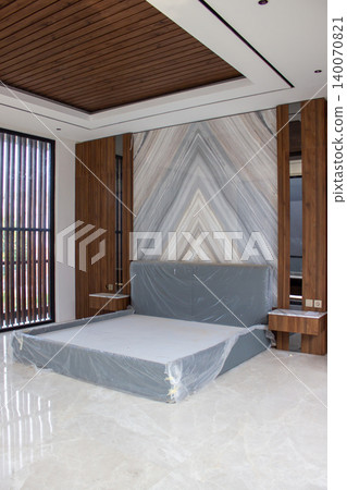 Bed wrapped in plastic protection with statuario marble wall panel. Bed wrapped in plastic protection with statuario marble wall panel. 140070821