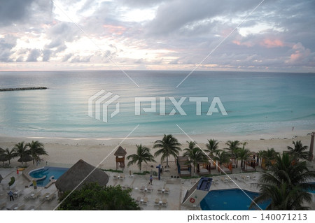 A beautiful view of the Caribbean beach from the balcony of a resort hotel in Cancun, Mexico. A beautiful view of the Caribbean beach from the balcony of a resort hotel in Cancun, Mexico. 140071213
