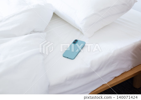 Smartphone on the bed 140071424