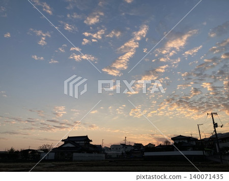 A cityscape with a sunset sky and telephone poles (Japanese scenery) A cityscape with a sunset sky and telephone poles (Japanese scenery) 140071435