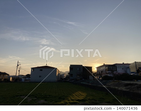 A cityscape with a sunset sky and telephone poles (Japanese scenery) A cityscape with a sunset sky and telephone poles (Japanese scenery) 140071436
