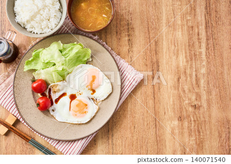 A breakfast of fried eggs with soy sauce, white rice, and miso soup. A breakfast of fried eggs with soy sauce, white rice, and miso soup. 140071540