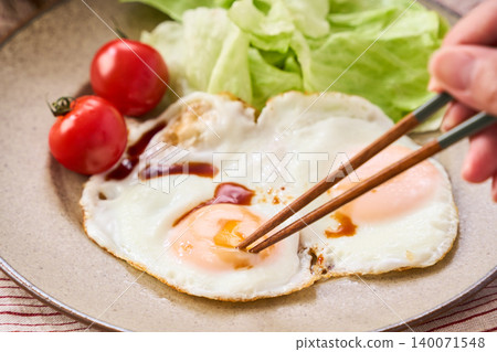 Fried egg over soy sauce Fried egg over soy sauce 140071548
