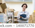Middle-aged female worker in a warehouse 140071770