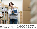 Middle-aged female worker in a warehouse 140071771