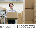 Middle-aged female worker in a warehouse 140071772