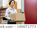 Middle-aged female worker in a warehouse 140071773