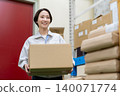 Middle-aged female worker in a warehouse 140071774