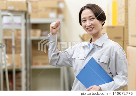 Middle-aged female worker in a warehouse Middle-aged female worker in a warehouse 140071776