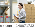 Middle-aged female worker in a warehouse 140071782