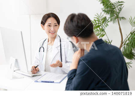 A man talking to a doctor A man talking to a doctor 140071819