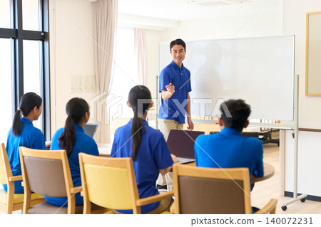 Asian caregivers training new recruits at a nursing home Asian caregivers training new recruits at a nursing home 140072231