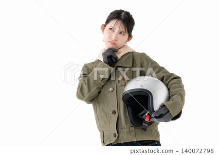 A female biker struggling A female biker struggling 140072798