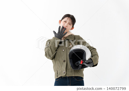 A female biker struggling A female biker struggling 140072799