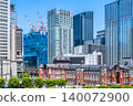 Tokyo's urban landscape: A new view of Tokyo Station. A breathtaking sight of towering skyscrapers and giant cranes lined up in a row... = May 19th 140072900