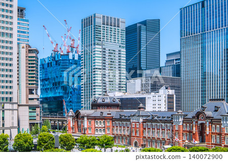 Tokyo's urban landscape: A new view of Tokyo Station. A breathtaking sight of towering skyscrapers and giant cranes lined up in a row... = May 19th Tokyo's urban landscape: A new view of Tokyo Station. A breathtaking sight of towering skyscrapers and giant cranes lined up in a row... = May 19th 140072900