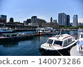 A scene of ships and modern buildings standing in Yokohama Port under a clear blue summer sky. 140073286
