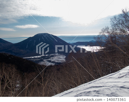 Snow-covered mountain climbing routes and surrounding areas of Mt. Nikko-Shirane 140073361