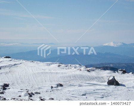 Snow-covered mountain climbing routes and surrounding areas of Mt. Nikko-Shirane 140073427