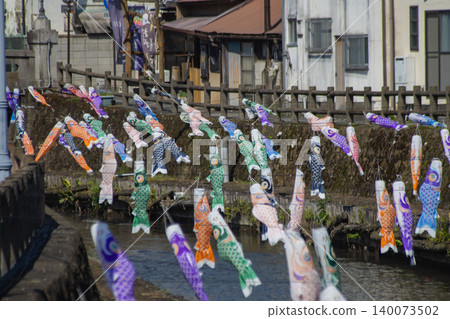 A carp streamer with a spiral pattern sways in the wind. A carp streamer with a spiral pattern sways in the wind. 140073502